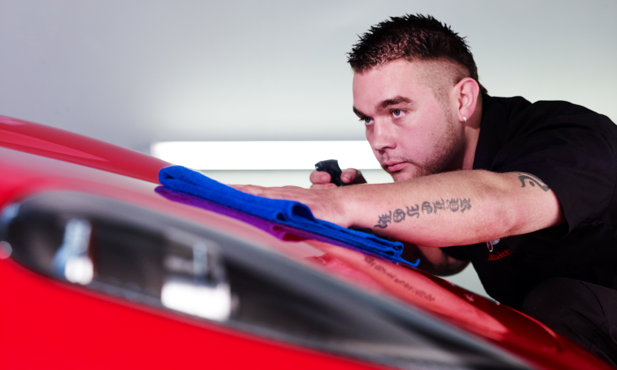 studebakers technician polishing ferrari